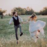 beautiful-bride-and-groom-at-sunset-in-green-natur-PS3WDVS.jpg